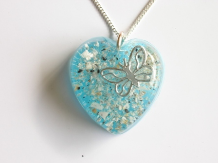 Coloured ashes and butterfly memorial pendant