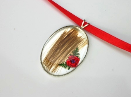 Hair and poppy keepsake pendant